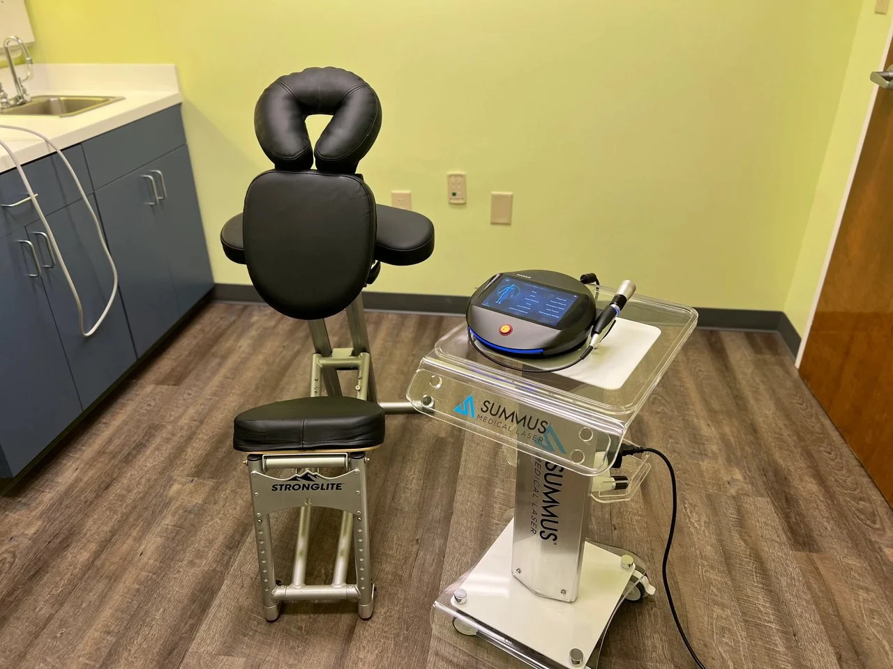 Class IV laser therapy unit and a specialized therapy chair at ProWellness Family Chiropractic